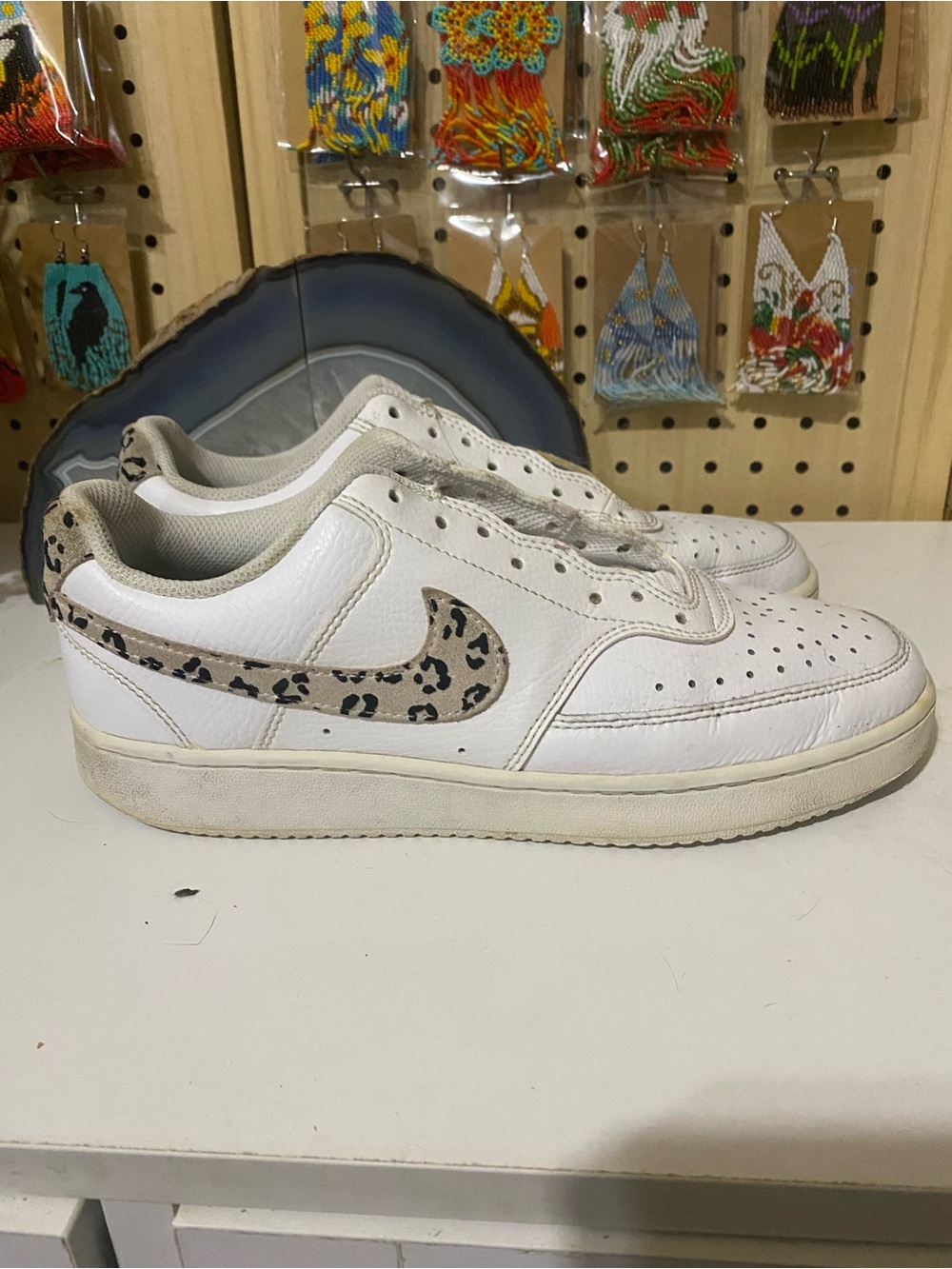 Nike White Low-Top Sneakers with Leopard Swoosh Accent